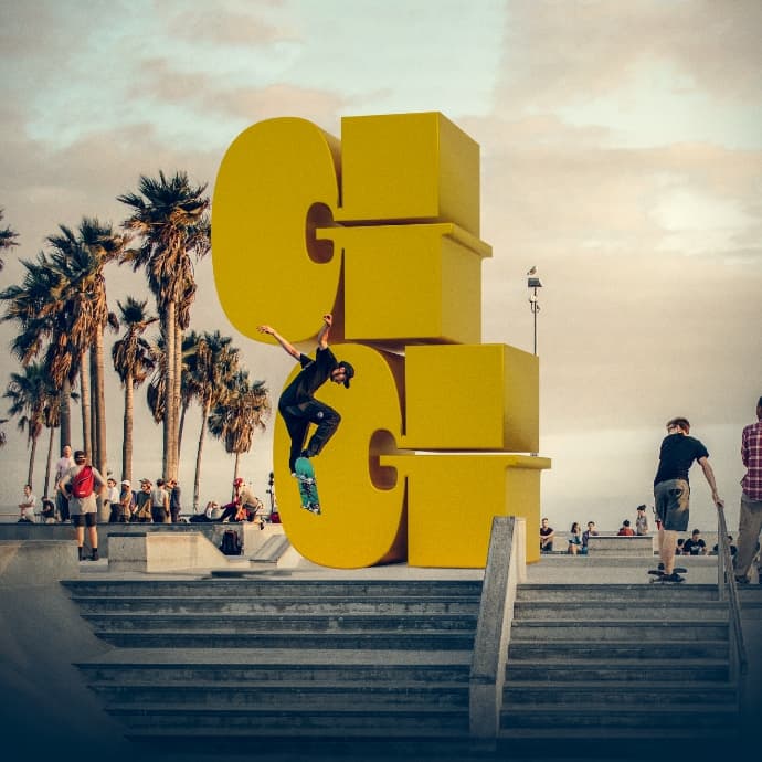 Skateboarders in front of the Golden Grizzlies logo